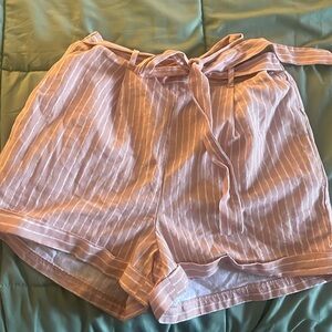 Sienna sky linen shorts with a tie. looks great with a plain black or white top!